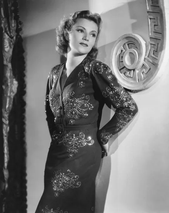 Framed Print : Annabella, modeling a blue crepe and sequin dinner dress from her own wardrobe, 1939 Framed Print : Annabella, modeling a blue crepe and sequin dinner dress from her own wardrobe, 1939