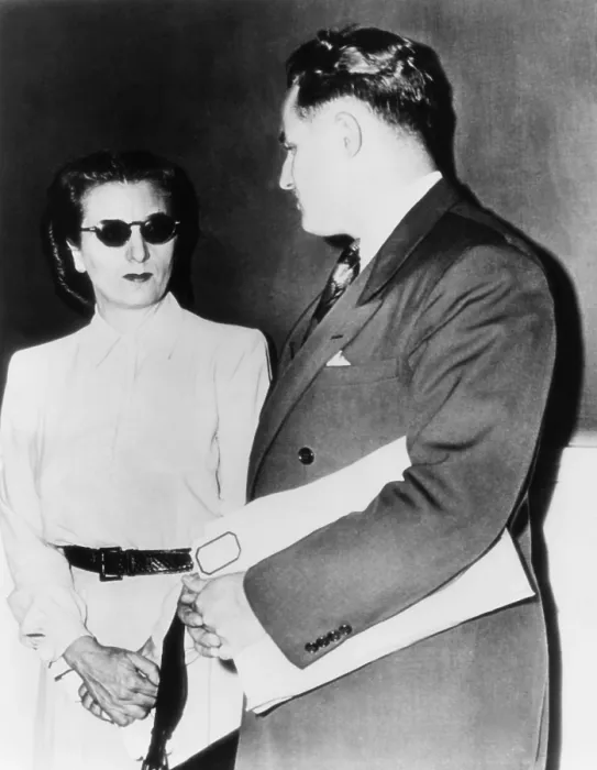 Framed Print : Annette Carvetto, widow of mob boss Frank Nitti, with her lawyer J. R. Stibel. She was subpoenaed to U.S. District Court over income taxes owed the government. August 1, 1946