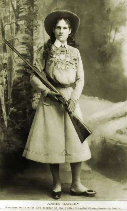 Framed Print : Annie Oakley (1860-1926) American sharpshooter bedecked with awards and medals in 1899