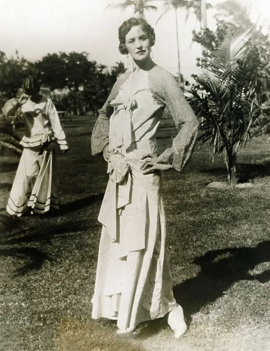 Framed Print : The annual mid-winter Miami Beach fashion show displays a long dress with a touch of lace about the shoulders, giving it an air of old Spain. Ca. 1925-30