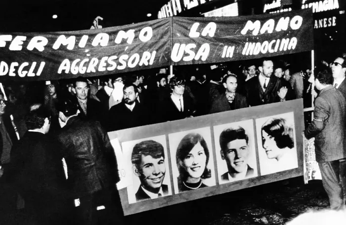Framed Print : Anti-Vietnam War protest in Milan, Italy. The demonstrators hold a banner with pictures of the four students killed at Kent State University. May, 7, 1970