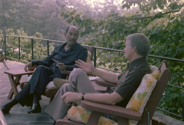 Framed Print : Anwar Sadat and Jimmy Carter at Camp David talking outdoors during the marathon summit that resulted in the Camp David Accords. Sept 5-17 1978
