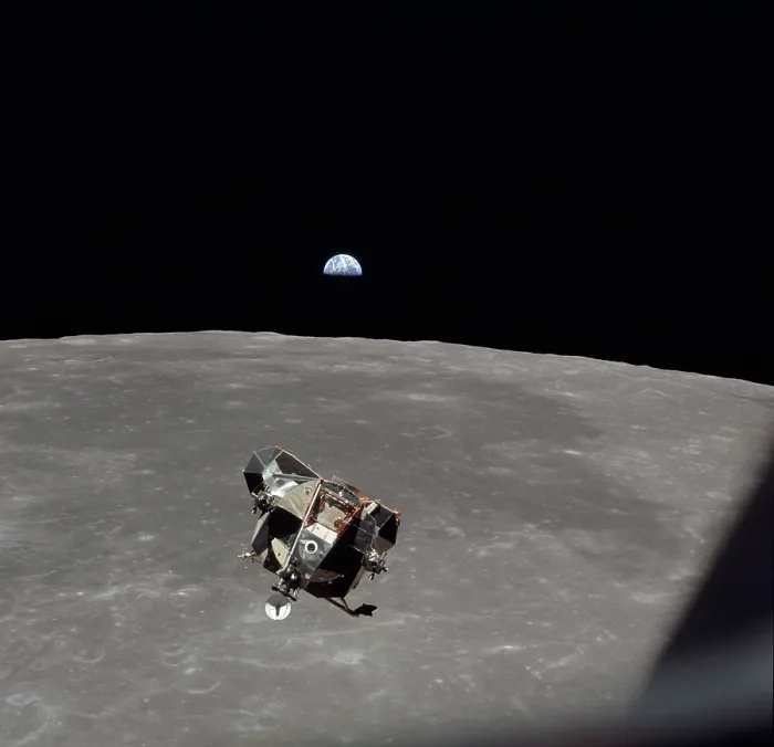 Framed Print : The Apollo 11 Lunar Module ascending from Moon's surface. In the background is Mare Smythii with the Earth on horizon. July 20, 1969