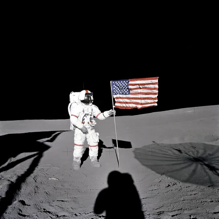 Framed Print : Apollo 14 Astronaut Alan B. Shepard stands by the US flag on the lunar Fra Mauro Highlands. 10 years earlier, Shepard made the first American manned space flight. Feb. 5, 1971