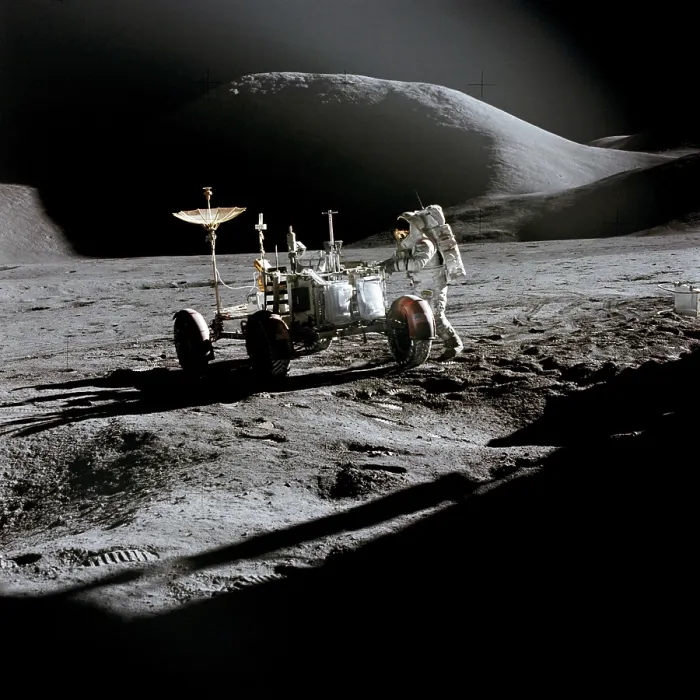 Framed Print : Apollo 15 astronaut James Irwin works at the Lunar Roving Vehicle at the Hadley-Apennine landing site. The shadow of the Lunar Module is in the foreground