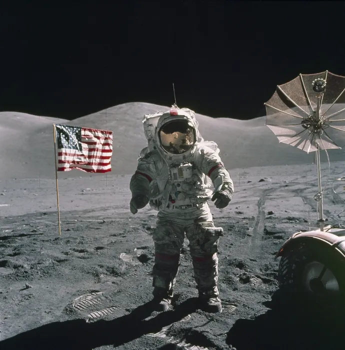 Framed Print : Apollo 17 Astronaut stands between a US flag and the Lunar Rover during the last US manned mission to the Moon. Dec. 12, 1971