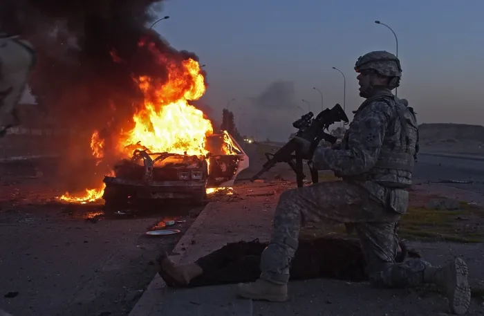 Framed Print : US Army soldier yells for a medic to treat an Iraqi civilian injured in a car bomb explosion in Mosul Iraq. March 6 2008. (BSLOC_2011_12_166)