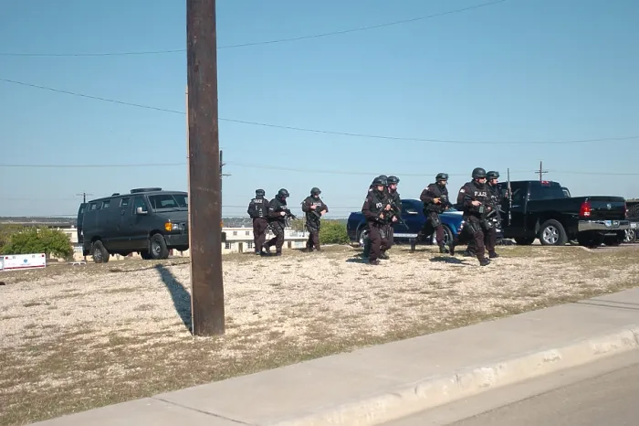 Framed Print : US Army SWAT team approaching a building where home-grown terrorist Major Nidal Malik Hasan is held up at Fort Hood Texas Nov. 5 2009 Framed Print : US Army SWAT team approaching a building where home-grown terrorist Major Nidal Malik Hasan is held up at Fort Hood Texas Nov. 5 2009