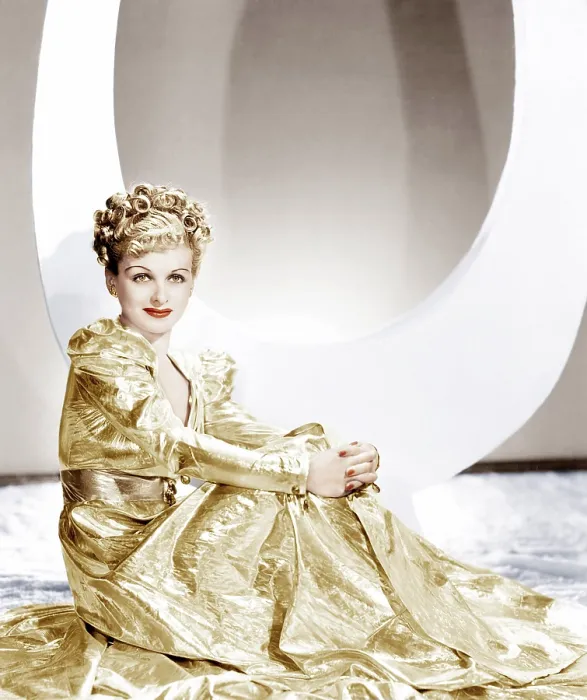 Framed Print : ARTISTS AND MODELS ABROAD, Joan Bennett wearing a gold lame negligee designed by Edith Head, 1938 Framed Print : ARTISTS AND MODELS ABROAD, Joan Bennett wearing a gold lame negligee designed by Edith Head, 1938