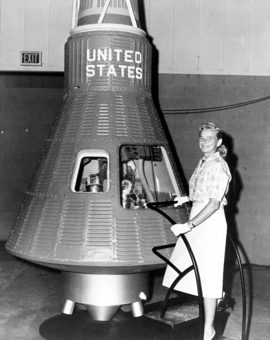 Framed Print : Astronaut Trainees Jerrie Cobb stands next to a Mercury spaceship capsule