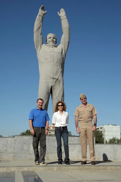Framed Print : US Astronauts and Russian Cosmonauts pose in front of a monumental statue of Yuri Gagarin