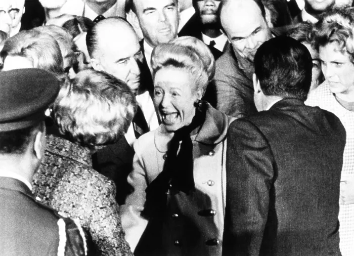 Framed Print : Atty. General John Mitchell and wife Martha, greet the Nixons on their return from Europe. October 5, 1970