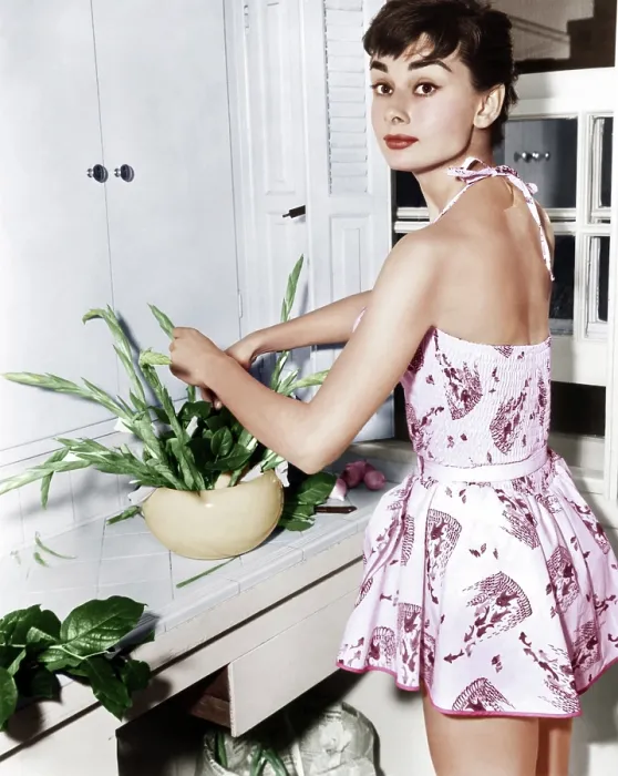 Framed Print : Audrey Hepburn creates a flower arrangement, ca. early 1950s Framed Print : Audrey Hepburn creates a flower arrangement, ca. early 1950s