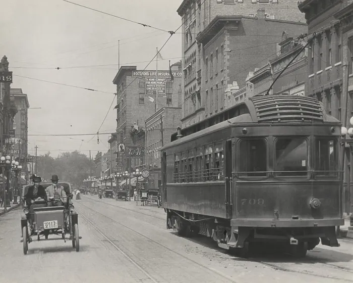Framed Print : An automobile shares a street with a trolley car in the business district of Rockford, Illinois, c.1910 Framed Print : An automobile shares a street with a trolley car in the business district of Rockford, Illinois, c.1910