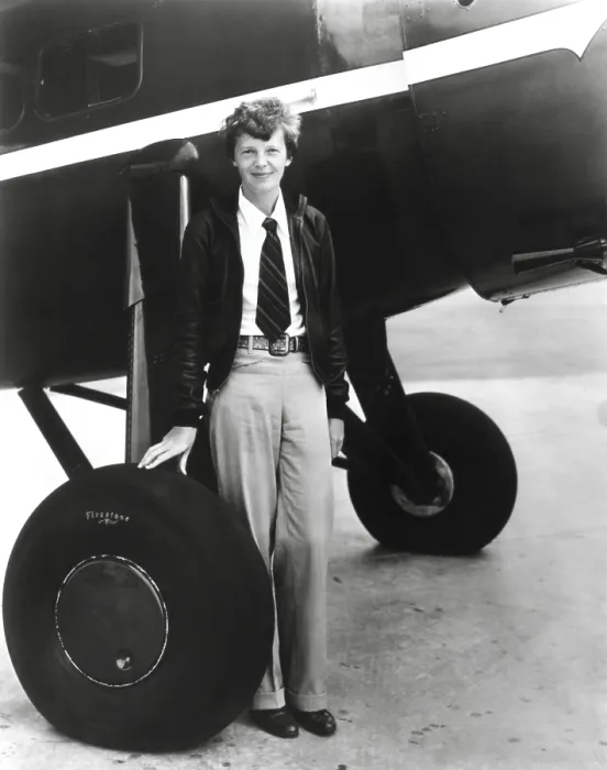 Framed Print : Aviator, Amelia Earhart, standing below her Bright Red Lockheed Vega airplane which she bought in 1929 Framed Print : Aviator, Amelia Earhart, standing below her Bright Red Lockheed Vega airplane which she bought in 1929