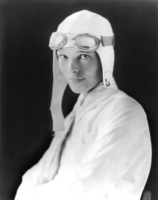 Framed Print : Aviator Amelia Earhart wearing white flying suit, cloth helmet and goggles, ca. 1929 (BSLOC_2021_3_2) Framed Print : Aviator Amelia Earhart wearing white flying suit, cloth helmet and goggles, ca. 1929 (BSLOC_2021_3_2)