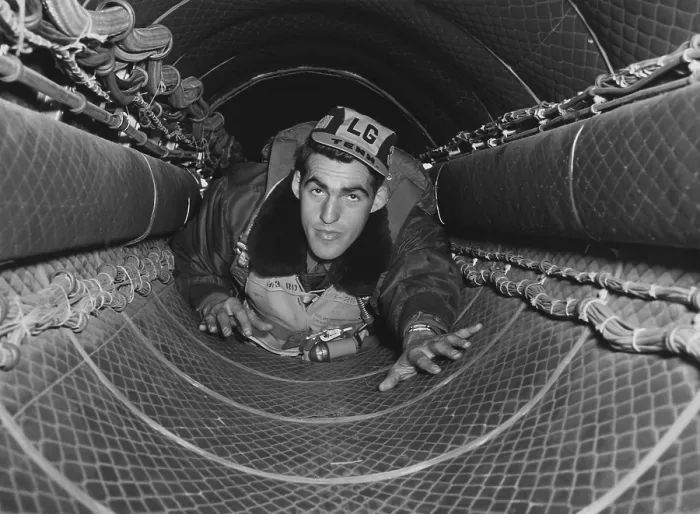Framed Print : B-29 gunner in the 35-foot tunnel connecting the forward and rear pressurized compartments