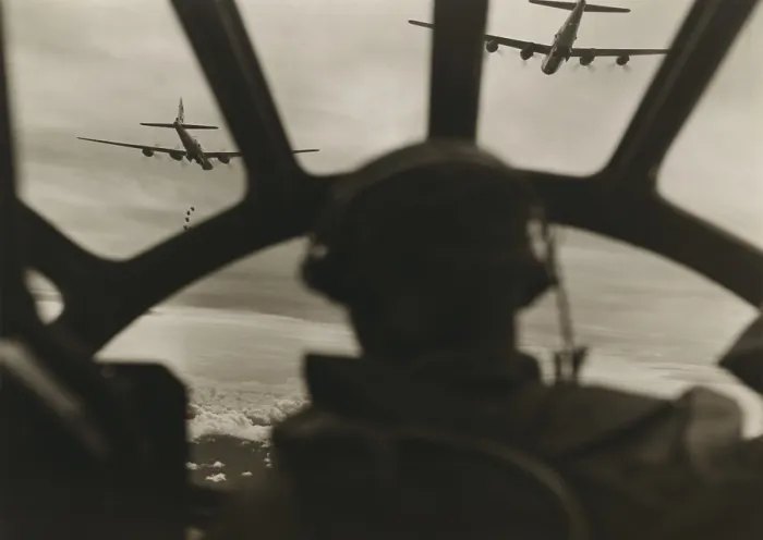 Framed Print : Two B-29 Super-fortresses drop bombs over Malaya as seen from the cockpit of a third bomber during a run over the important railway yards Framed Print : Two B-29 Super-fortresses drop bombs over Malaya as seen from the cockpit of a third bomber during a run over the important railway yards