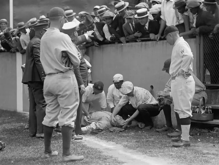 Framed Print : Babe Ruth knocked unconscious, at Griffith Stadium, Washington, D.C. Ruth ran into a concrete wall while trying to catch a foul ball on July 5, 1924. (BSLOC_2015_17_28)