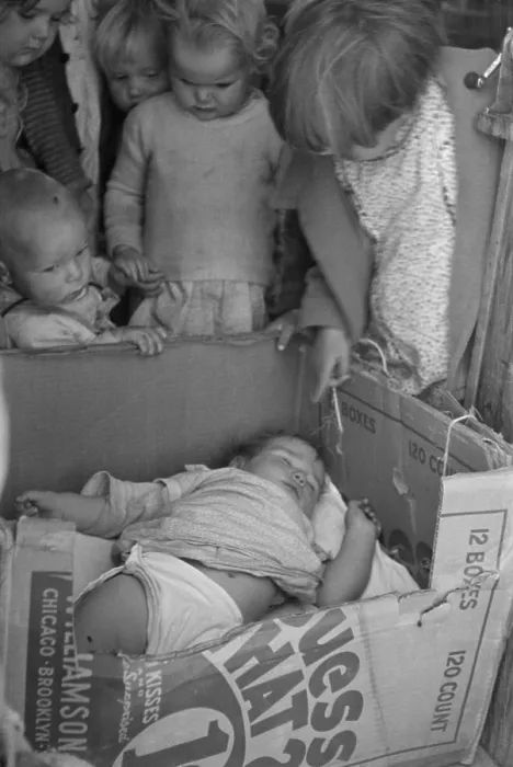 Framed Print : Baby in a cardboard box crib at a Kern California migrant camp pre-school while mother works in the fields. Nov. 1936 photo by Dorothea Lange Framed Print : Baby in a cardboard box crib at a Kern California migrant camp pre-school while mother works in the fields. Nov. 1936 photo by Dorothea Lange