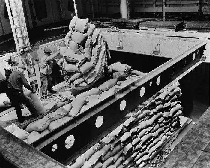 Framed Print : Bags of flour are loaded for shipment to Tunisia from a American port to feed recently liberated Tunisians. Ca. 1943-44 Framed Print : Bags of flour are loaded for shipment to Tunisia from a American port to feed recently liberated Tunisians. Ca. 1943-44