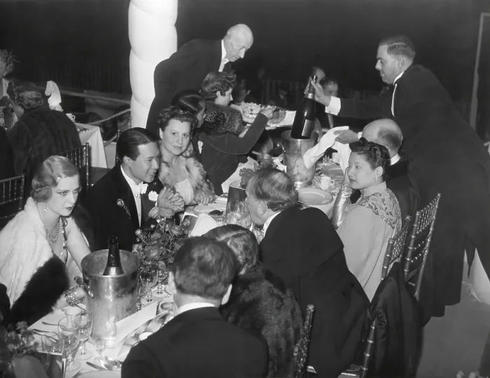 Framed Print : Bao Dai and his wife, Nam Phuong, dine with fashionable friends at Nuit de Longchamp in Paris. Ca. 1935-38