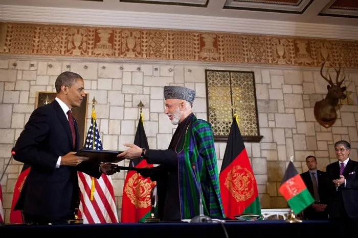 Framed Print : Barack Obama and Hamid Karzai exchange documents after signing the strategic partnership agreement. Presidential Palace in Kabul, Afghanistan, May 1, 2012. (BSLOC_2015_3_140)