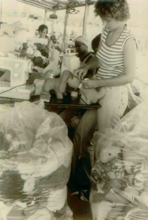 Framed Print : Barbara Cordell and Erin Leroy and others working on stuffed animal production. People's Temple Agricultural Project. Jonestown, Guyana. Nov. 1978