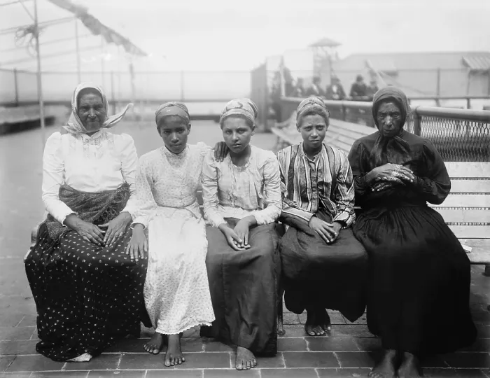 Framed Print : Barefoot women immigrants at Ellis Island are from the Caribbean. Ca. 1910