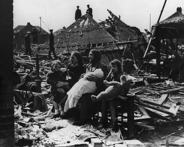 Framed Print : Battle of Britain, World War 2. British family seated outside their bombed home and neighborhood. Ca. 1940-41. (BSLOC_2013_11_94) Framed Print : Battle of Britain, World War 2. British family seated outside their bombed home and neighborhood. Ca. 1940-41. (BSLOC_2013_11_94)