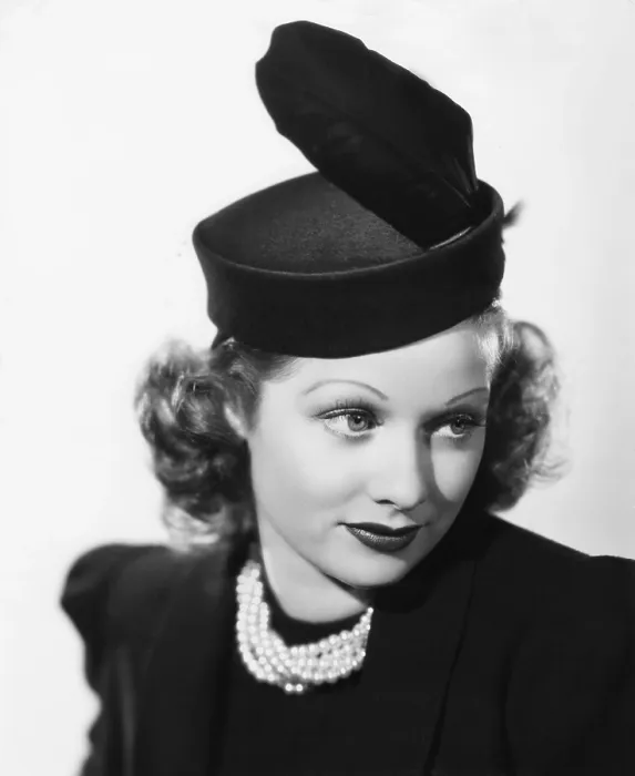 Framed Print : BEAUTY FOR THE ASKING, Lucille Ball, modeling a black felt pillbox hat with feather, 1939