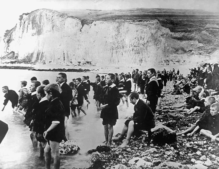 Framed Print : Belgian school children swimming at a beach near Dieppe, Belgium, during an American Red Cross outing. World War I. Ca. 1917-18