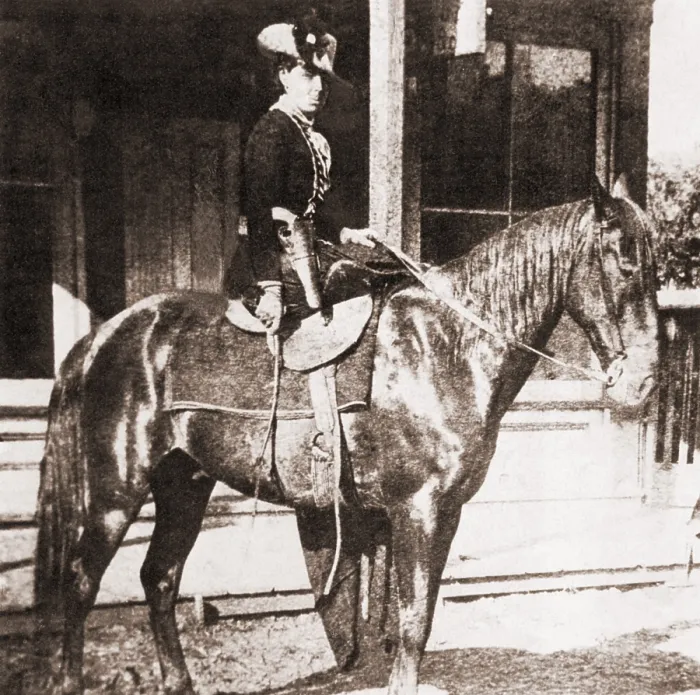 Framed Print : Belle Starr (1848-1889) on a horse. She rode in side saddle, and dressed in velvet, with feathered hats. Gene Tierney starred in the 1941 film, BELLE STARR Framed Print : Belle Starr (1848-1889) on a horse. She rode in side saddle, and dressed in velvet, with feathered hats. Gene Tierney starred in the 1941 film, BELLE STARR