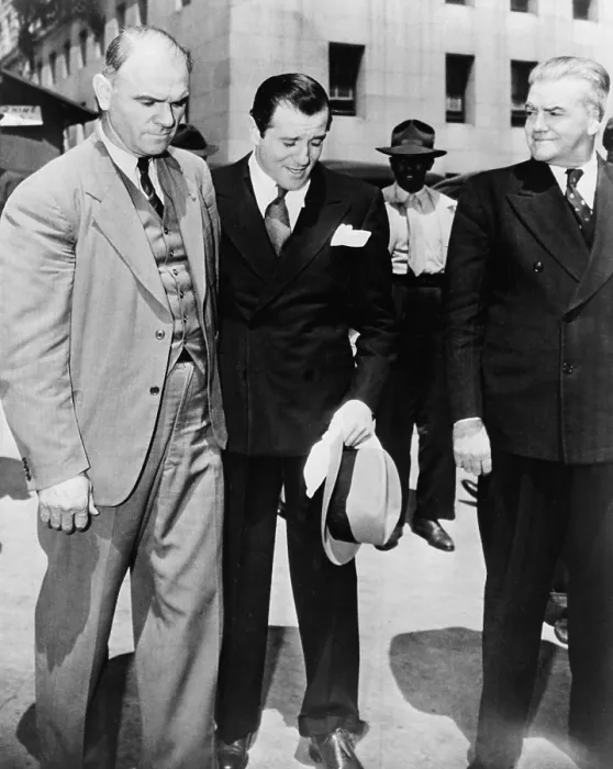 Framed Print : Benny Bugsy Siegel (1906-1947), under arrest and in the custody of U.S. Marshals in Los Angeles. 1941. Warren Beatty played Seigel in the 1991 film BUGSY