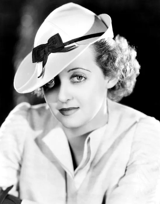 Framed Print : Bette Davis, modeling a snap-brim sports hat of beige felt with a brown grosgrain ribbon, 1937 Framed Print : Bette Davis, modeling a snap-brim sports hat of beige felt with a brown grosgrain ribbon, 1937