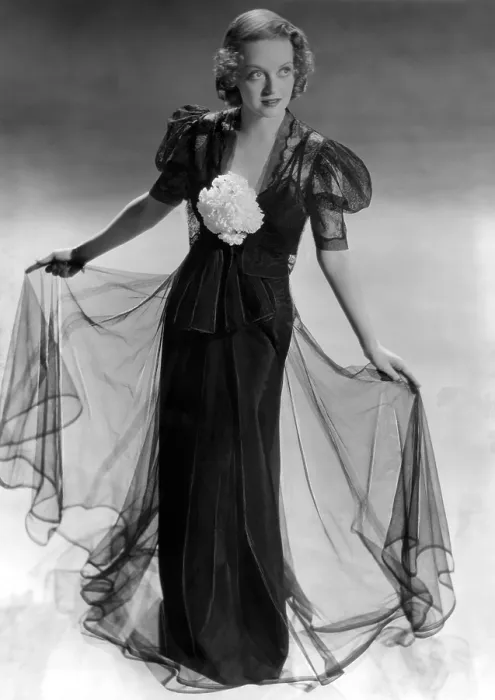 Framed Print : Bette Davis wearing black taffeta gown with black lace bolero jacket, ca. 1937 Framed Print : Bette Davis wearing black taffeta gown with black lace bolero jacket, ca. 1937
