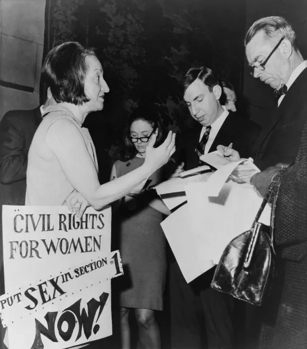 Framed Print : Betty Friedan, president of the National Organization for Women, talks to reporters in the lobby of New York State Assembly