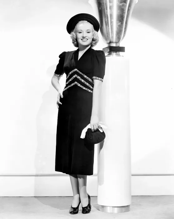 Framed Print : Betty Grable, modeling a black crepe spring frock trimmed with white embroidery, 1938 Framed Print : Betty Grable, modeling a black crepe spring frock trimmed with white embroidery, 1938