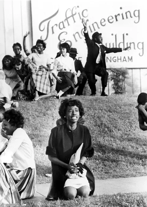Framed Print : Birmingham, Alabama: A young woman kneels in prayer on sidewalk outside city traffic engineering building, 5 / 5 / 63, during anti-segregation protest demonstration Framed Print : Birmingham, Alabama: A young woman kneels in prayer on sidewalk outside city traffic engineering building, 5 / 5 / 63, during anti-segregation protest demonstration