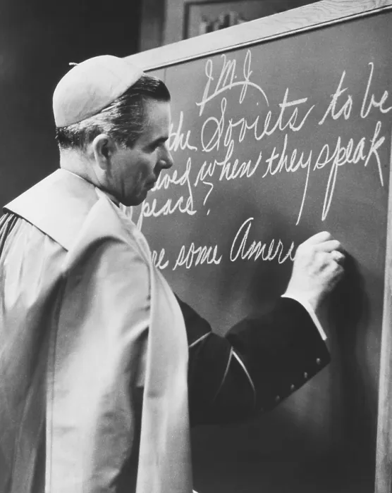 Framed Print : Bishop Fulton Sheen writing on blackboard during the broadcast of his TV show, LIFE IS WORTH LIVING. Nov. 1, 1954
