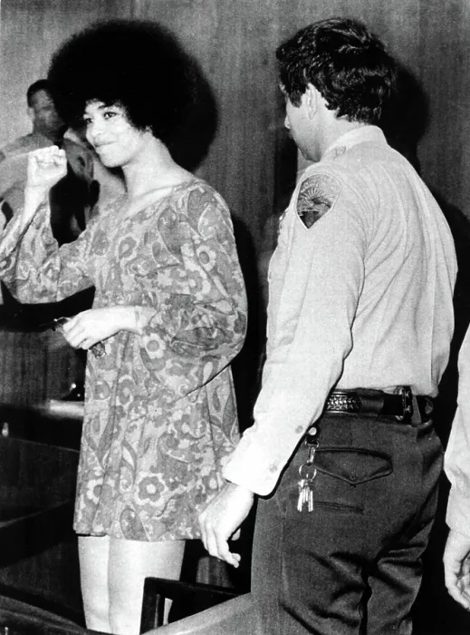 Framed Print : Black militant Angela Davis gives clenched fist salute as she appears briefly, Dec. 23, 1970 to face charges of conspiracy, kidnap and murder