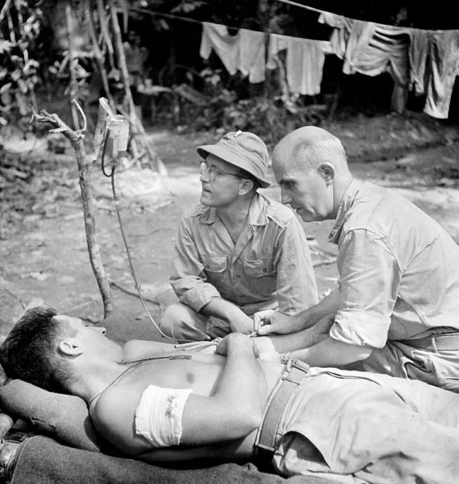 Framed Print : Blood Transfusion. A wounded man behind the lines on the Buna front being given a blood transfusion. Buna, New Guinea. 1942