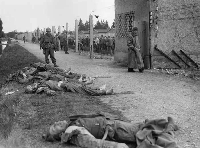 Framed Print : Bodies of former SS guards lie on the bank of a moat surrounding the Dachau Concentration Camp. Liberated prisoner's killed the guards by beating them to death Framed Print : Bodies of former SS guards lie on the bank of a moat surrounding the Dachau Concentration Camp. Liberated prisoner's killed the guards by beating them to death