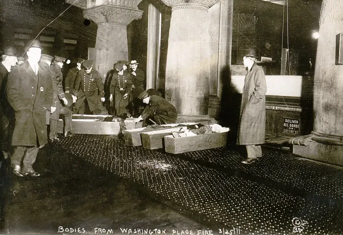 Framed Print : Bodies from Triangle Shirtwaist fire. City officials placing Triangle Shirtwaist Company fire victims in coffins. March 25, 1911