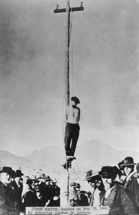 Framed Print : Body of lynched John Heith hangs from telegraph pole in Tombstone Arizona, Feb. 22, 1884. He was convicted of planning the robbery that became the Bisbee Massacre of Dec Framed Print : Body of lynched John Heith hangs from telegraph pole in Tombstone Arizona, Feb. 22, 1884. He was convicted of planning the robbery that became the Bisbee Massacre of Dec