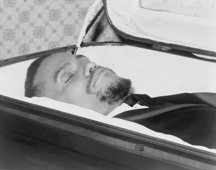 Framed Print : The body of Malcolm X, slain Negro nationalist leader, lies in casket at the Unity Funeral Home