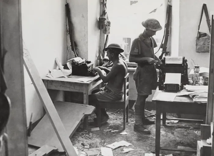 Framed Print : In their bomb damaged office, British soldiers at produce a news sheet. It appears daily under the title of Tobruk Truch'. 1941 during World War 2. (BSLOC_2013-12_51) Framed Print : In their bomb damaged office, British soldiers at produce a news sheet. It appears daily under the title of Tobruk Truch'. 1941 during World War 2. (BSLOC_2013-12_51)