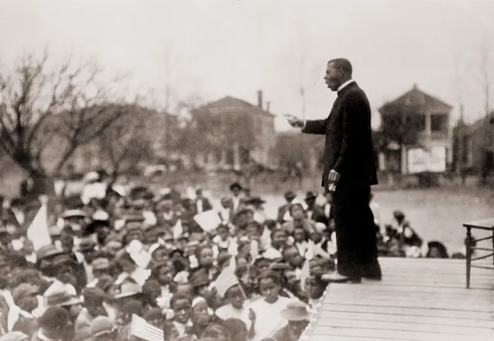 Framed Print : Booker T. Washington (1856-1915), speaking to an African American school children Framed Print : Booker T. Washington (1856-1915), speaking to an African American school children