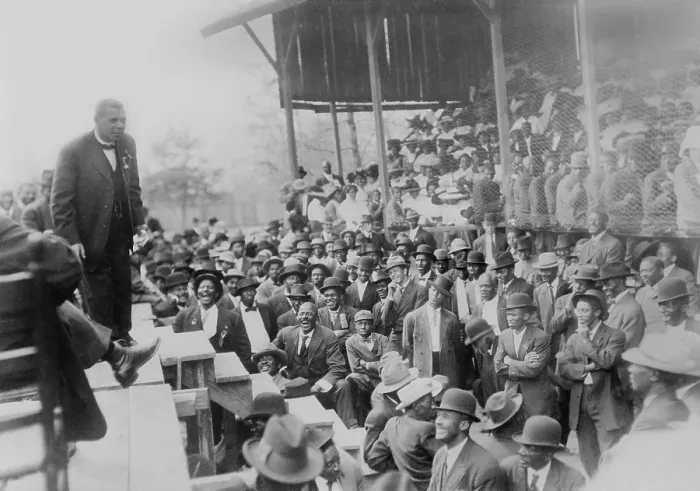 Framed Print : Booker T. Washington addressing a laughing crowd of African American men in Lakeland, Tennessee, during his campaign promoting African American education. Ca. 1900