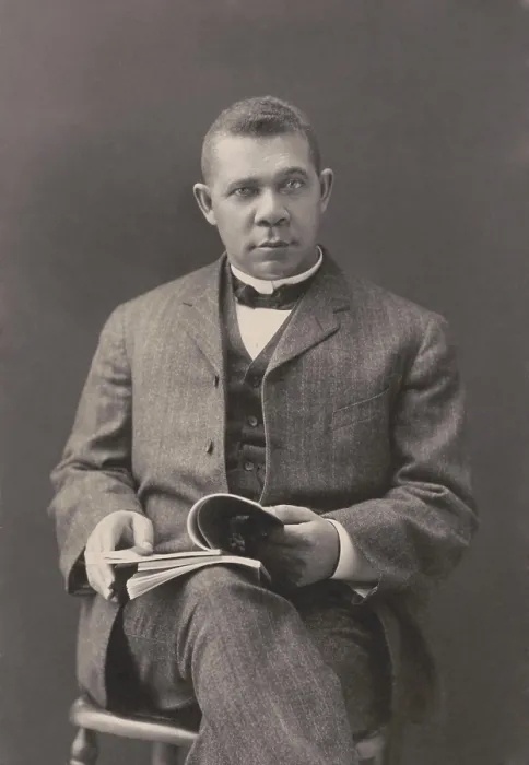 Framed Print : Booker T. Washington sits with books on his lap, c. 1903 Framed Print : Booker T. Washington sits with books on his lap, c. 1903